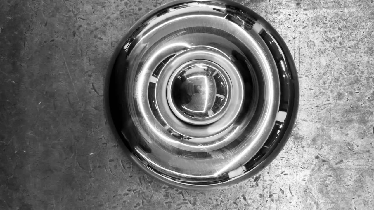 A polished steel die with concentric rings